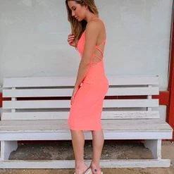 Day + Night Neon Coral Low Cut Cage Back Dress