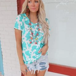 Avery Clara Turquoise Cow Print Top Apparel